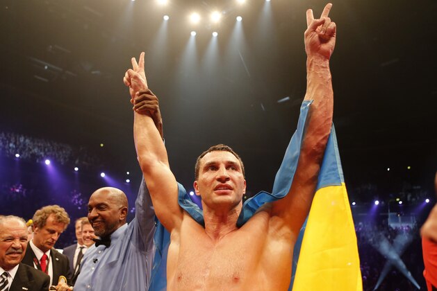 IBF, WBA, WBO and IBO champion Wladimir Klitschko from Ukraine celebrates winning the heavyweight world title bout against his Australian challenger Alex Leapai in Oberhausen, western Germany, Saturday, April 26, 2014. (AP Photo/Frank Augstein) IBF, WBA, WBO and IBO champion Wladimir Klitschko from Ukraine celebrates winning the heavyweight world title bout against his Australian challenger Alex Leapai in Oberhausen, western Germany, Saturday, April 26, 2014. (AP Photo/Frank Augstein)