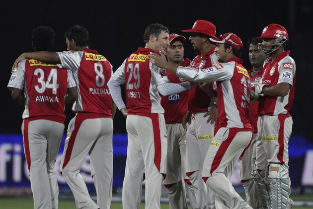 Kings XI Punjab bowler David Hussey, third from left, celebrates the wicket of Deccan Chargers Daniel Harris with his team members during their Indian Premier League (IPL) cricket match in Hyderabad, India, Tuesday, May 8, 2012.(AP Photo/Mahesh Kumar A.)