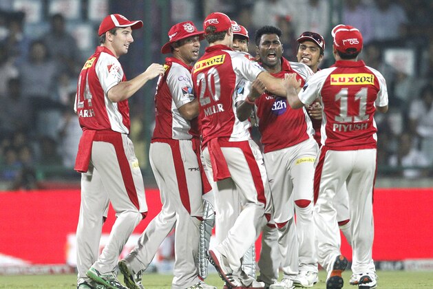 Kings XI Punjab Parvinder Awana , third left,celebrates the wicket of Delhi Daredevils' Ross Taylor,unseen,  during an Indian Premier League (IPL) cricket match, in New Delhi, India , Tuesday, May 15, 2012.  (AP Photo/ Manish Swarup)