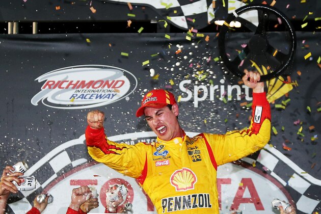 RICHMOND, VA - APRIL 26:  Joey Logano, driver of the #22 Shell-Pennzoil Ford, celebrates in Victory Lane after winning the NASCAR Sprint Cup Series Toyota Owners 400 at Richmond International Raceway on April 26, 2014 in Richmond, Virginia.  (Photo by Todd Warshaw/Getty Images)