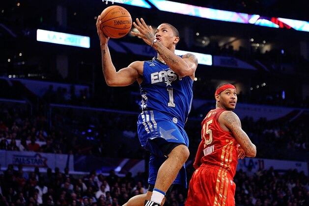 LOS ANGELES, CA - FEBRUARY 20:  Derrick Rose #1 of the Chicago Bulls and the Eastern Conference goes up for a shot past Carmelo Anthony #15 of the Denver Nuggets and the Western Conference in the 2011 NBA All-Star Game at Staples Center on February 20, 2011 in Los Angeles, California. NOTE TO USER: User expressly acknowledges and agrees that, by downloading and or using this photograph, User is consenting to the terms and conditions of the Getty Images License Agreement.  (Photo by Kevork Djansezian/Getty Images)