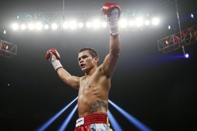 Marcos Maidana, of Argentina, celebrates his victory over Jesus Soto Karass, of Mexico, following their welterweight boxing match, Saturday, Sept. 15, 2012, in Las Vegas. (AP Photo/Isaac Brekken)