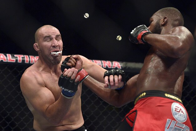 Apr 26, 2014; Baltimore, MD, USA;  Jon Jones hits  Glover Teixeira with an upper cut during the UFC light heavy weight championship fight at  Baltimore Arena. Jones retained the light heavy height championship by defeating  Teixeria.  Mandatory Credit: Tommy Gilligan-USA TODAY Sports
