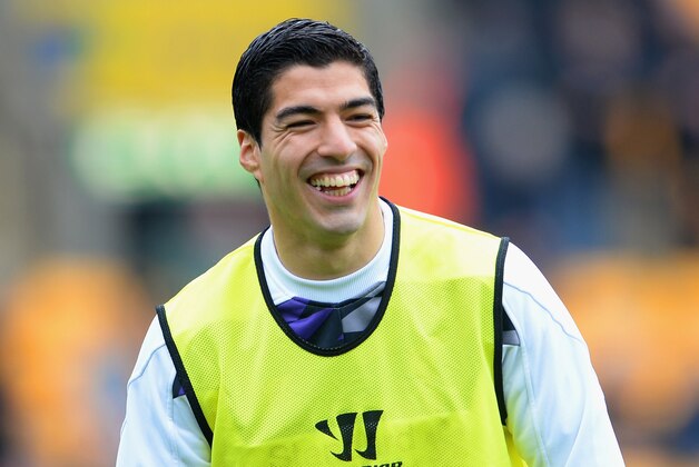 NORWICH, ENGLAND - APRIL 20:  Luis Suarez of Liverpool smiles as he warms up during the Barclays Premier League match between Norwich City and Liverpool at Carrow Road on April 20, 2014 in Norwich, England.  (Photo by Michael Regan/Getty Images)