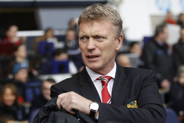 Manchester United's manager David Moyes looks on from the dugout before the start of their English Premier League soccer match against Tottenham Hotspur at White Hart Lane, London, Sunday, Dec. 1, 2013. (AP Photo/Sang Tan)