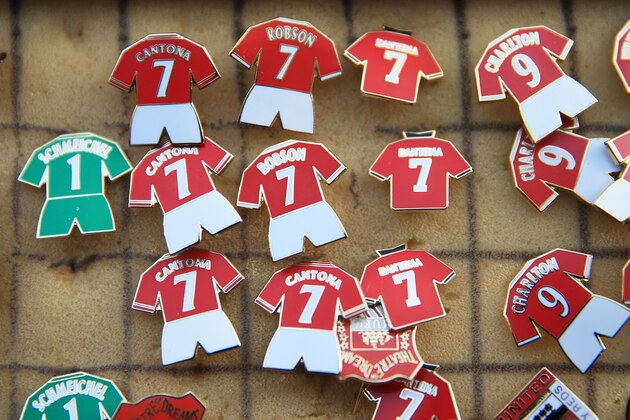 MANCHESTER, ENGLAND - DECEMBER 07:  Pin badges for sale prior to kickoff during the Barclays Premier League match between Manchester United and Newcastle United at Old Trafford on December 7, 2013 in Manchester, England.  (Photo by Richard Heathcote/Getty Images)