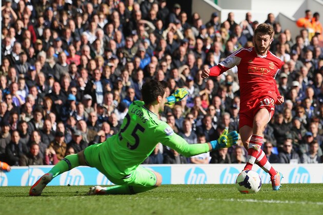 LONDON, ENGLAND - MARCH 23:  Adam Lallana of Southampton scores his team's second goal past Hugo Lloris of Tottenham Hotspur during the Barclays Premier League match between Tottenham Hotspur and Southampton at White Hart Lane on March 23, 2014 in London, England.  (Photo by Clive Rose/Getty Images)
