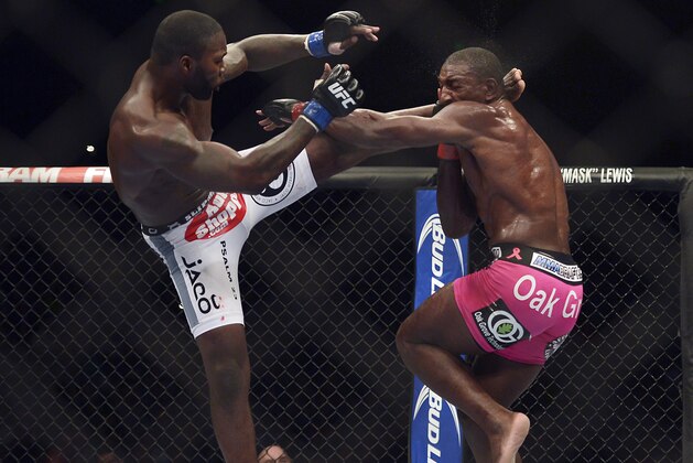 Apr 26, 2014; Baltimore, MD, USA;   Anthony Johnson (blue gloves) fights Phil Davis (red gloves) during UFC 172 at Baltimore Arena.  Mandatory Credit: Tommy Gilligan-USA TODAY Sports