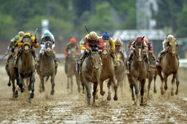 May 4, 2013; Louisville, KY, USA; Joel Rosario aboard Orb (middle) leads the field down the final stretch to win the 2013 Kentucky Derby at Churchill Downs. Mandatory Credit: Jamie Rhodes-USA TODAY Sports
