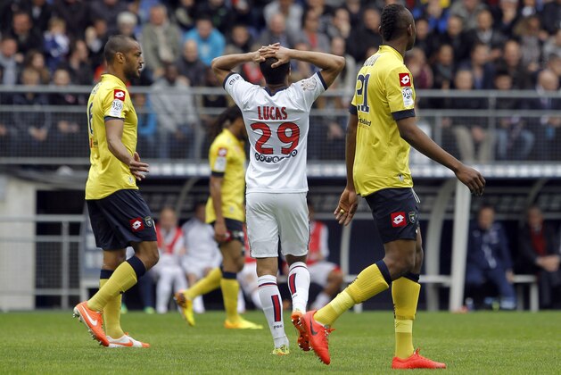 Paris Saint Germain's Lucas Rodrigues Moura Da Silva, center, reacts during their French League One soccer match against Sochaux, in Sochaux, eastern France, Sunday, April 27, 2014. (AP Photo/Laurent Cipriani)
