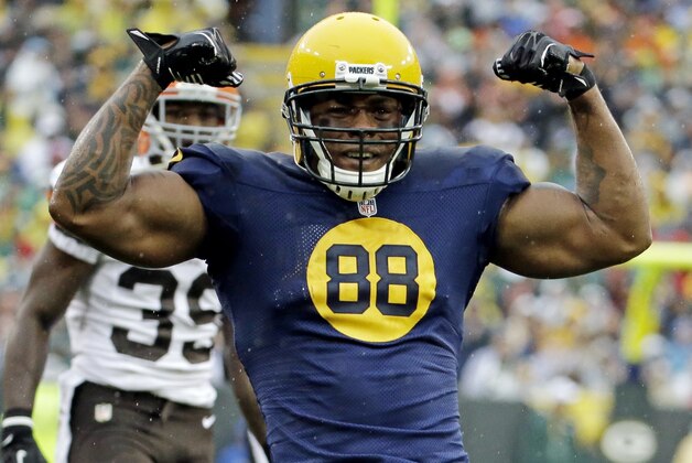 FILE - In this Oct. 20, 2013, file photo, Green Bay Packers' Jermichael Finley reacts after catching a pass during the first half of an NFL football game against the Cleveland Browns, in Green Bay, Wis. Finley has tweeted that he left the intensive care unit and had full feeling in his arms and legs after injuring his neck in a game. Finley posted Monday night, Oct. 21, 2013, on Twitter that he was able to walk to and from the shower. He thanked family, friends, teammates and fans for an outpouring of support. (AP Photo/Morry Gash, File)
