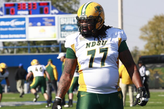 North Dakota State offensive tackle Billy Turner warms up before an NCAA college football game versus Indiana State in Terre Haute, Ind., Saturday, Oct. 26, 2013.  (AP Photo/Brent Smith)