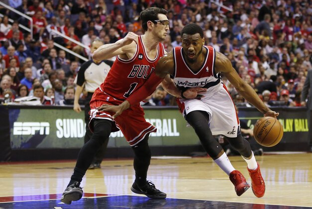 Apr 27, 2014; Washington, DC, USA; Washington Wizards guard John Wall (2) dribbles the ball as Chicago Bulls guard Kirk Hinrich (12) defends in the second quarter in game four of the first round of the 2014 NBA Playoffs at Verizon Center. Mandatory Credit: Geoff Burke-USA TODAY Sports