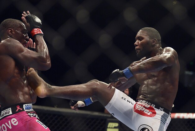 Apr 26, 2014; Baltimore, MD, USA;   Anthony Johnson (blue gloves) fights Phil Davis (red gloves) during UFC 172 at Baltimore Arena.  Mandatory Credit: Tommy Gilligan-USA TODAY Sports