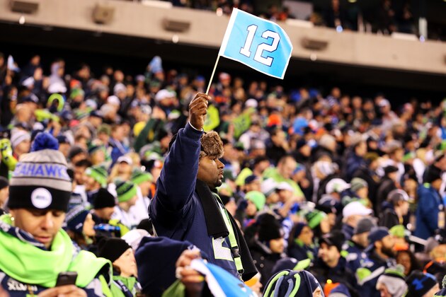 EAST RUTHERFORD, NJ - FEBRUARY 02: A Seattle fan holds a '12th Man' flag during the third quarter of Super Bowl XLVIII at MetLife Stadium on February 2, 2014 in East Rutherford, New Jersey.  (Photo by Christian Petersen/Getty Images)