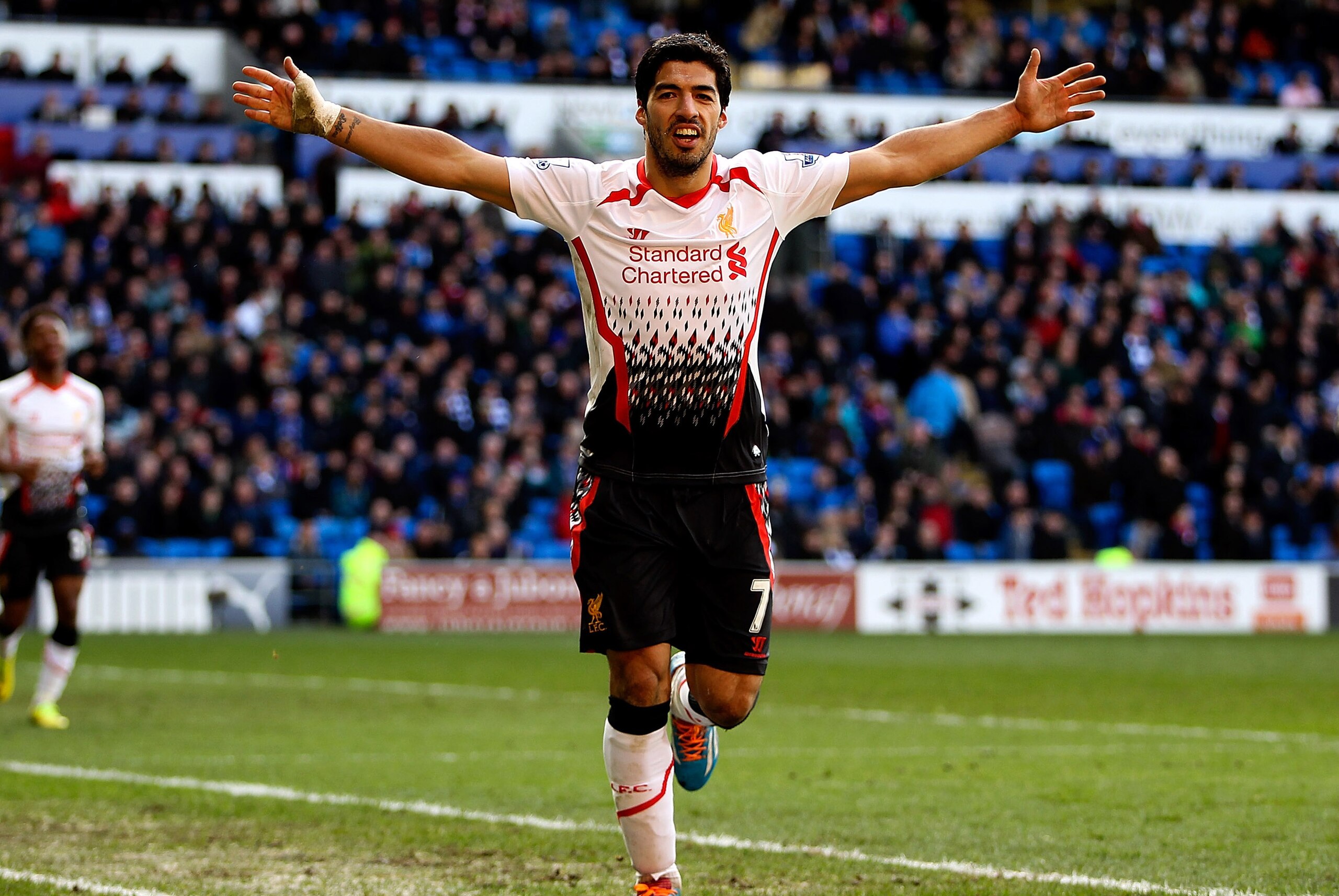 CARDIFF, WALES - MARCH 22:  Luis Suarez of Liverpool celebrates after scoring hihs third and his team's sixth goal of the game during the Barclays Premier League match between Cardiff City and Liverpool at Cardiff City Stadium on March 22, 2014 in Cardiff, Wales.  (Photo by Ben Hoskins/Getty Images)