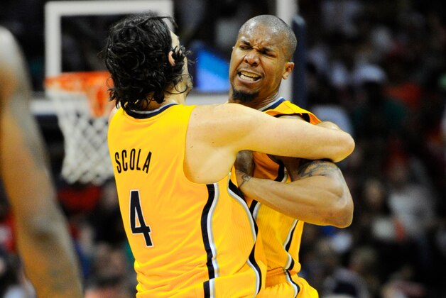 Apr 26, 2014; Atlanta, GA, USA; Indiana Pacers forward David West (21) reacts with teammate forward Luis Scola (4) after making a key shot late in the game against the Atlanta Hawks during the second half in game four of the first round of the 2014 NBA Playoffs at Philips Arena. The Pacers defeated the Hawks 91-88. Mandatory Credit: Dale Zanine-USA TODAY Sports
