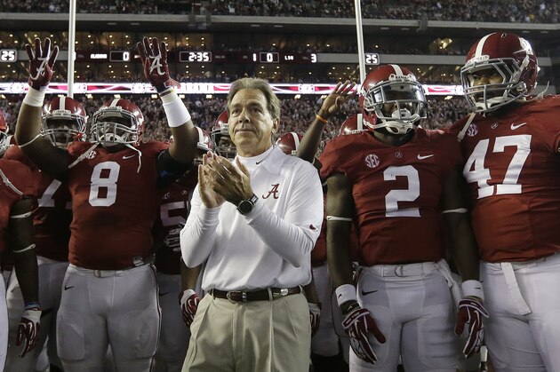 Alabama head coach Nick Saban prepares to lead his team onto the field in the first half of an NCAA college football game against LSU in Tuscaloosa, Ala., Saturday, Nov. 9, 2013.  (AP Photo/Dave Martin)