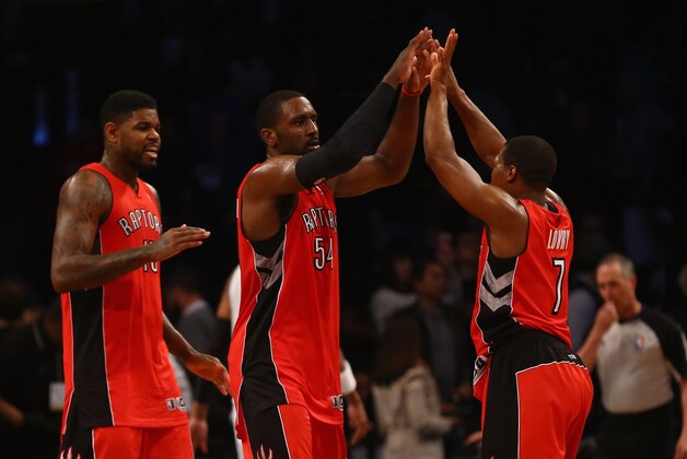 NEW YORK, NY - APRIL 27: Kyle Lowry #7, Patrick Patterson #54, and DeMar DeRozan #10 of the Toronto Raptors celebrate a 87-79 win against the Brooklyn Nets  in Game Four of the Eastern Conference Quarterfinals during the 2014 NBA Playoffs at the Barclays Center on April 27, 2014 in the Brooklyn borough of New York City.  NOTE TO USER: User expressly acknowledges and agrees that, by downloading and or using this photograph, User is consenting to the terms and conditions of the Getty Images License Agreement.  (Photo by Al Bello/Getty Images)