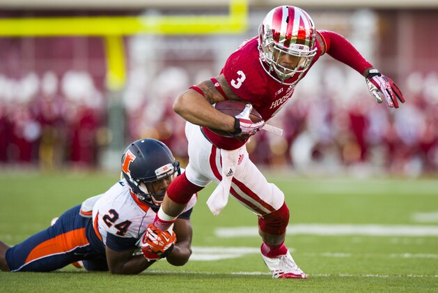 Indiana's Cody Latimer (3) is tackled by Illinois' Darius Mosely (24) during the first half of an NCAA college football game, Saturday, Nov. 9, 2013, in Bloomington, Ind. (AP Photo/Doug McSchooler)