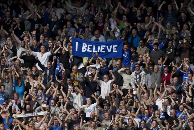 Jubilant Chelsea fans celebrate as their team defeat Liverpool 2-0 in their English Premier League soccer match against Liverpool at Anfield Stadium, Liverpool, England, Sunday April 27, 2014. (AP Photo/Jon Super)