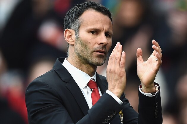 MANCHESTER, ENGLAND - APRIL 26: Ryan Giggs of Manchester United applauds the fans after a rousing victory in his first match as manager during the Barclays Premier League match between Manchester United and Norwich City at Old Trafford on April 26, 2014 in Manchester, England.  (Photo by Laurence Griffiths/Getty Images)