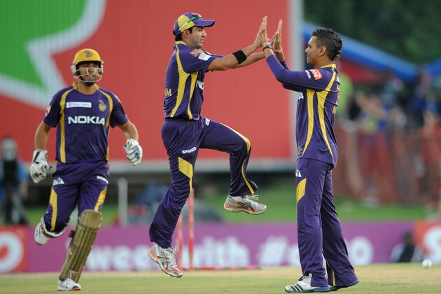 PRETORIA, SOUTH AFRCA - OCTOBER 13:  Sunil Narine (R) of the Knight Riders celebrates with Gautam Gambhir after capturing the wicket of Mahela Jayawardene (not pictured) of the Daredevils during the Karbonn Smart CLT20 Group A match between Kolkata Knight Riders (IPL) and Delhi Daredevils (IPL) at SuperSport Park on October 13, 2012 in Pretoria, South Africa.  (Photo by Lee Warren/Gallo Images/Getty Images)