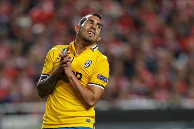 Juventus' Carlos Tevez reacts after missing a chance to score  during the Europa League semifinal, first leg, soccer match between Benfica and Juventus Thursday, April 24 2014, at Benfica's Luz stadium in Lisbon. Benfica won 2-1. (AP Photo/Armando Franca)