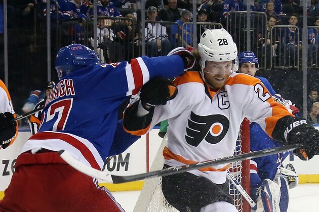 NEW YORK, NY - APRIL 27: Ryan McDonagh #27 of the New York Rangers hits Claude Giroux #28 of the Philadelphia Flyers in Game Five of the First Round of the 2014 NHL Stanley Cup Playoffs at Madison Square Garden on April 27, 2014 in New York City. The Rangers defeated the Flyers 4-2.  (Photo by Bruce Bennett/Getty Images)