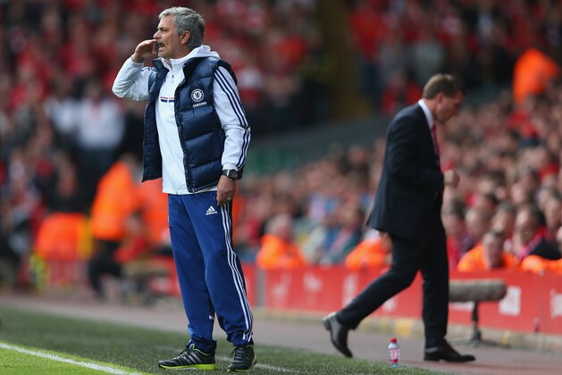 LIVERPOOL, ENGLAND - APRIL 27: Jose Mourinho manager of Chelsea gives his team instructions as Liverpool manager Brendan Rodgers walks away showing his dejectioin during the Barclays Premier League match between Liverpool and Chelsea at Anfield on April 27, 2014 in Liverpool, England. (Photo by Clive Brunskill/Getty Images) LIVERPOOL, ENGLAND - APRIL 27: Jose Mourinho manager of Chelsea gives his team instructions as Liverpool manager Brendan Rodgers walks away showing his dejectioin during the Barclays Premier League match between Liverpool and Chelsea at Anfield on April 27, 2014 in Liverpool, England. (Photo by Clive Brunskill/Getty Images)