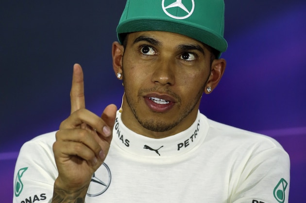 Mercedes driver Lewis Hamilton of Britain speaks during the press conference after the Chinese Formula One Grand Prix at Shanghai International Circuit in Shanghai, Sunday, April 20, 2014. (AP Photo/Alexander F. Yuan)