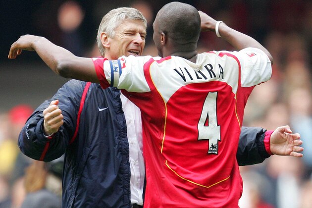 ** FILE ** Arsenal's Patrick Vieira embraces his team coach Arsene Wenger at the end of the FA Cup Final against Manchester United at the Millennium Stadium in Cardiff, Wales, Saturday May 21, 2005. Vieira will face his former Arsenal teammates in the quarter final of the Champions League following the draw on Friday March 10, 2006. (AP Photo/Alastair Grant)