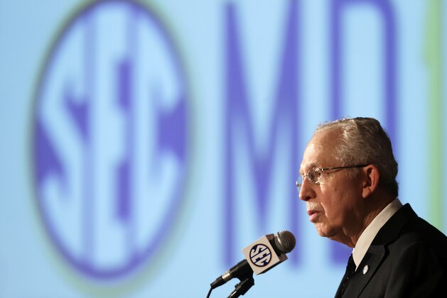 Southeastern Conference Commissioner Mike Slive talks with reporters during the SEC football Media Days in Hoover, Ala., Tuesday, July 16, 2013. (AP Photo/Dave Martin)
