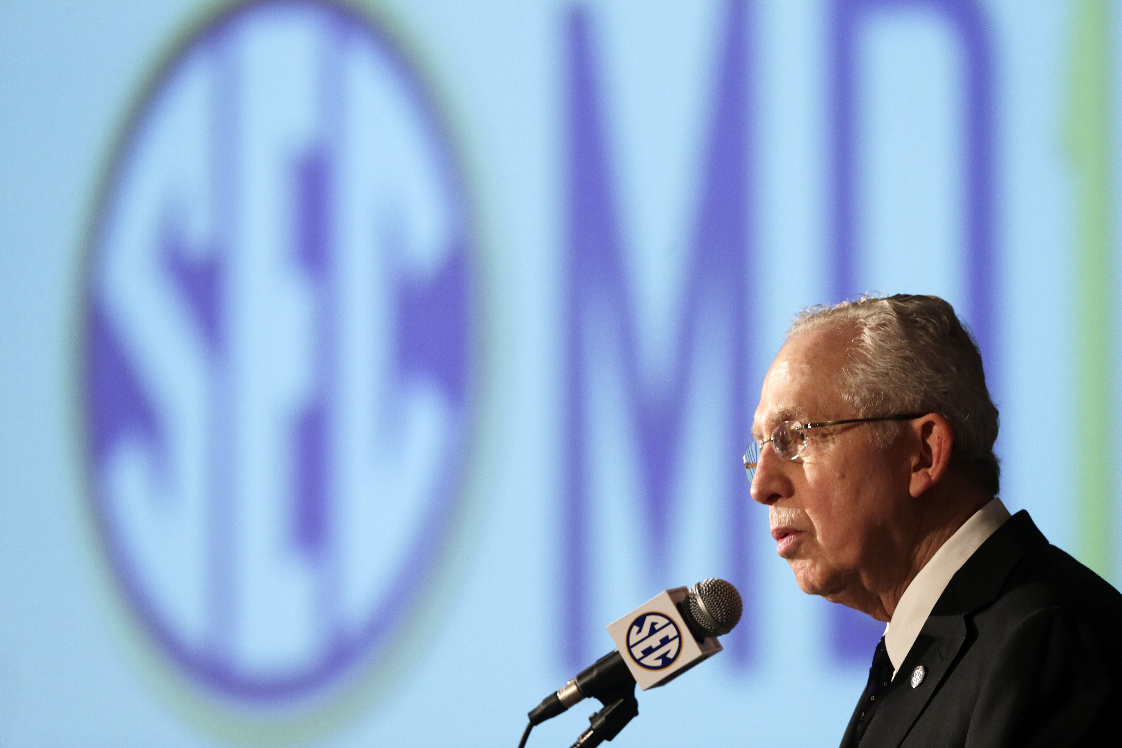 Southeastern Conference Commissioner Mike Slive talks with reporters during the SEC football Media Days in Hoover, Ala., Tuesday, July 16, 2013. (AP Photo/Dave Martin)