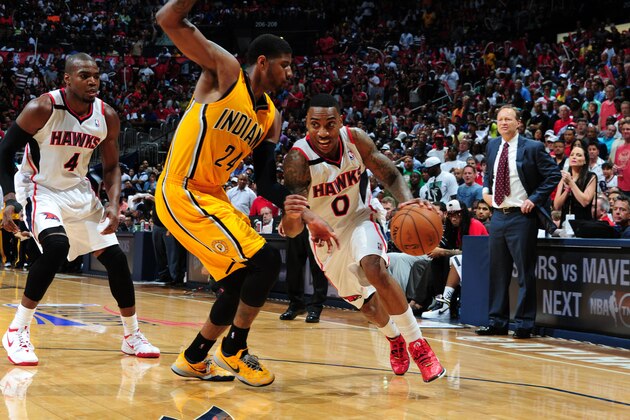 ATLANTA, GA - APRIL 26: Jeff Teague #0 of the Atlanta Hawks drives to the basket against the Indiana Pacers during Game Four of the Eastern Conference Quarterfinals on April 26, 2014 at Philips Arena in Atlanta, Georgia.  NOTE TO USER: User expressly acknowledges and agrees that, by downloading and/or using this Photograph, user is consenting to the terms and conditions of the Getty Images License Agreement. Mandatory Copyright Notice: Copyright 2014 NBAE (Photo by Scott Cunningham/NBAE via Getty Images)