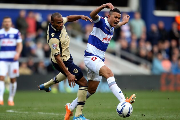 LONDON, ENGLAND - MARCH 01:  Rodolph Austin of Leeds battles with Jermaine Jenas of QPR during the Sky Bet Championship match between Queens Park Rangers and Leeds United at Loftus Road on March 1, 2014 in London, England.  (Photo by Ben Hoskins/Getty Images)