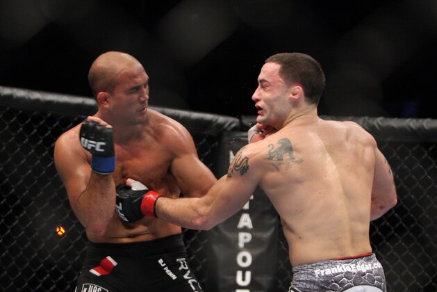 Frankie Edgar, right, in action against BJ Penn during their UFC fight at the TD Garden on Saturday, August 28, 2010 in Boston, MA. Edgar retained his UFC lightweight title via unanimous decision. (AP Photo/Gregory Payan)