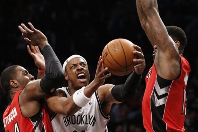 Toronto Raptors forward Patrick Patterson (54) and Raptors forward Amir Johnson (15) defend Brooklyn Nets forward Paul Pierce (34) as pierce goes up for a layup in the second half of Game 4 of an NBA basketball first-round playoff series at the Barclays Center, Sunday, April 27, 2014, in New York. The Raptors evened the series at 2-2 defeating the Nets 87-79. (AP Photo/Kathy Willens) Toronto Raptors forward Patrick Patterson (54) and Raptors forward Amir Johnson (15) defend Brooklyn Nets forward Paul Pierce (34) as pierce goes up for a layup in the second half of Game 4 of an NBA basketball first-round playoff series at the Barclays Center, Sunday, April 27, 2014, in New York. The Raptors evened the series at 2-2 defeating the Nets 87-79. (AP Photo/Kathy Willens)