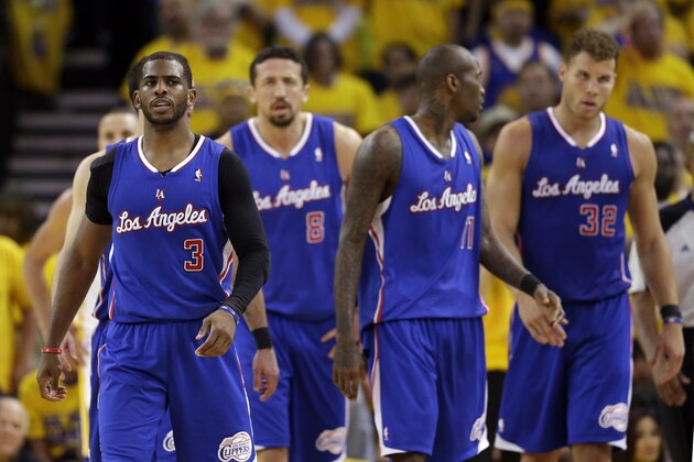 Los Angeles Clippers' Chris Paul, Hedo Turkoglu (8), Jamal Crawford (11) and Blake Griffin (32) walk back to their bench in the closing minutes of a 118-97 loss to the Golden State Warriors during the second half in Game 4 of an opening-round NBA basketball playoff series on Sunday, April 27, 2014, in Oakland, Calif. (AP Photo/Marcio Jose Sanchez)
