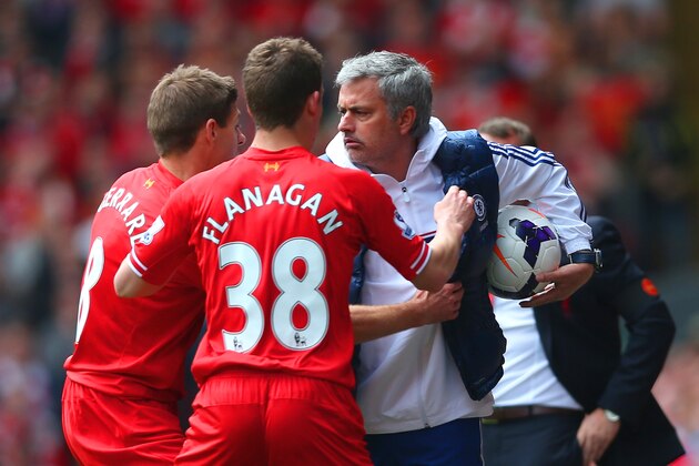 LIVERPOOL, ENGLAND - APRIL 27: (EDITORS NOTE: Retransmission of image 487057275 with alternate crop.) Steven Gerrard and Jon Flanagan of Liverpool have words with Jose Mourinho manager of Chelsea as he holds onto the ball during the Barclays Premier League match between Liverpool and Chelsea at Anfield on April 27, 2014 in Liverpool, England. (Photo by Clive Brunskill/Getty Images)