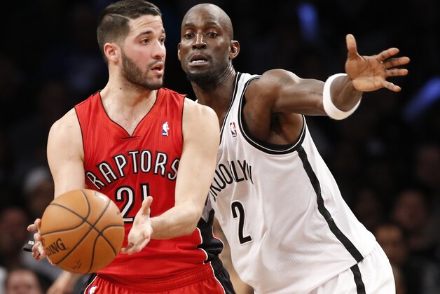 Brooklyn Nets center Kevin Garnett (2) defends as Toronto Raptors guard Greivis Vasquez (21) looks to pass in the second half of Game 4 of an NBA basketball first-round playoff series at the Barclays Center, Sunday, April 27, 2014, in New York. The Raptors evened the series at 2-2 defeating the Nets 87-79. (AP Photo/Kathy Willens)