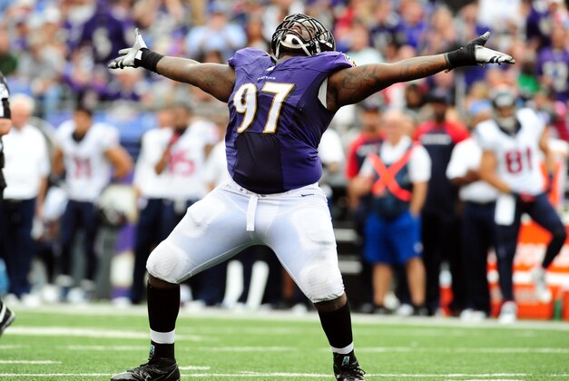 Sep 22, 2013; Baltimore, MD, USA; Baltimore Ravens defensive tackle Arthur Jones (97) celebrates after recording a sack in the fourth quarter against the Houston Texans at M&T Bank Stadium. Mandatory Credit: Evan Habeeb-USA TODAY Sports