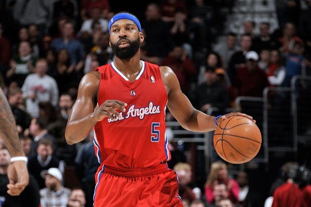 CLEVELAND, OH - FEBRUARY 11: Baron Davis #5 of the Los Angeles Clippers  moves the ball against the Cleveland Cavaliers on February 11, 2011 at the Quicken Loans Arena in Cleveland, Ohio. NOTE TO USER: User expressly acknowledges and agrees that, by downloading and/or using this Photograph, user is consenting to the terms and conditions of the Getty Images License Agreement. Mandatory Copyright Notice: Copyright 2011 NBAE (Photo by David Liam Kyle/NBAE via Getty Images)