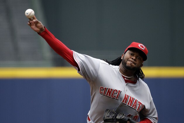 Cincinnati Reds starting pitcher Johnny Cueto throws in the first inning of a baseball game against the Atlanta Braves, Sunday, April 27, 2014, in Atlanta. (AP Photo/David Goldman)