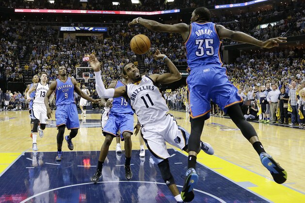 Memphis Grizzlies guard Mike Conley (11) is fouled by Oklahoma City Thunder forward Kevin Durant (35) in the second half of Game 4 of an opening-round NBA basketball playoff series Saturday, April 26, 2014, in Memphis, Tenn. Oklahoma City won in overtime 92-89. (AP Photo/Mark Humphrey)