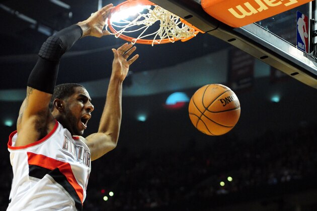 PORTLAND, OR - APRIL  27: LaMarcus Aldridge #12 of the Portland Trail Blazers dunks the ball in the second half of Game Four of the Western Conference Quarterfinals against the Houston Rockets during the 2014 NBA Playoffs at the Moda Center on April 27, 2014 in Portland, Oregon. The Blazers won the game 123-120. NOTE TO USER: User expressly acknowledges and agrees that, by downloading and or using this photograph, User is consenting to the terms and conditions of the Getty Images License Agreement. (Photo by Steve Dykes/Getty Images)