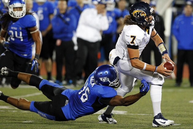 Kent State's David Fisher (7) is stopped by Buffalo's Khalil Mack (46) during the second half of an NCAA college football game in Amherst, N.Y., Wednesday, Sept. 19, 2012. Kent State won 23-7. (AP Photo/Bill Wippert)
