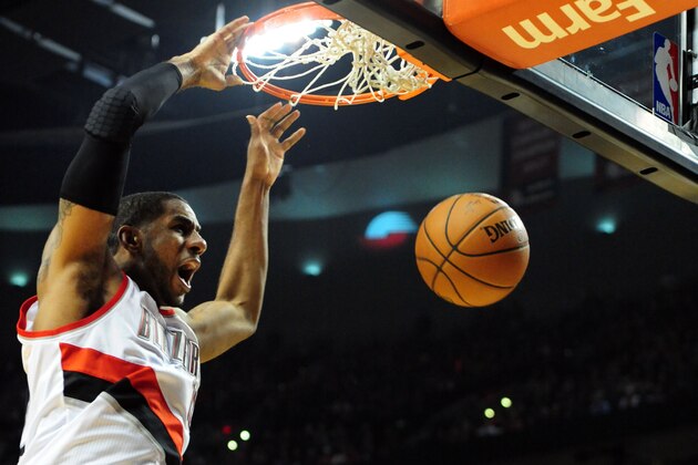PORTLAND, OR - APRIL  27: LaMarcus Aldridge #12 of the Portland Trail Blazers dunks the ball in the second half of Game Four of the Western Conference Quarterfinals against the Houston Rockets during the 2014 NBA Playoffs at the Moda Center on April 27, 2014 in Portland, Oregon. The Blazers won the game 123-120. NOTE TO USER: User expressly acknowledges and agrees that, by downloading and or using this photograph, User is consenting to the terms and conditions of the Getty Images License Agreement. (Photo by Steve Dykes/Getty Images)