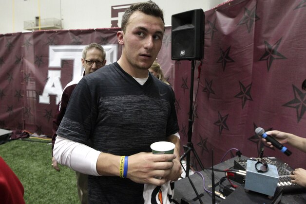 Texas A&M quarterback Johnny Manziel leaves the McFerrin Athletic Center after pro day for NFL football representatives in College Station, Texas, Thursday, March 27, 2014. (AP Photo/Patric Schneider) Texas A&M quarterback Johnny Manziel leaves the McFerrin Athletic Center after pro day for NFL football representatives in College Station, Texas, Thursday, March 27, 2014. (AP Photo/Patric Schneider)