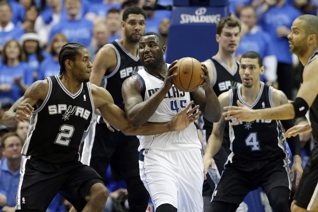 Dallas Mavericks' DeJuan Blair (45) attempts to pass the ball after pulling in a rebound against San Antonio Spurs' Kawhi Leonard (2), as Tim Duncan, from left rear, Tiago Splitter, Danny Green (4) and Tony Parker, right, watch during the second half of Game 4 of an NBA basketball first-round playoff series, Monday, April 28, 2014, in Dallas. The Spurs won 93-89. (AP Photo/Tony Gutierrez) Dallas Mavericks' DeJuan Blair (45) attempts to pass the ball after pulling in a rebound against San Antonio Spurs' Kawhi Leonard (2), as Tim Duncan, from left rear, Tiago Splitter, Danny Green (4) and Tony Parker, right, watch during the second half of Game 4 of an NBA basketball first-round playoff series, Monday, April 28, 2014, in Dallas. The Spurs won 93-89. (AP Photo/Tony Gutierrez)